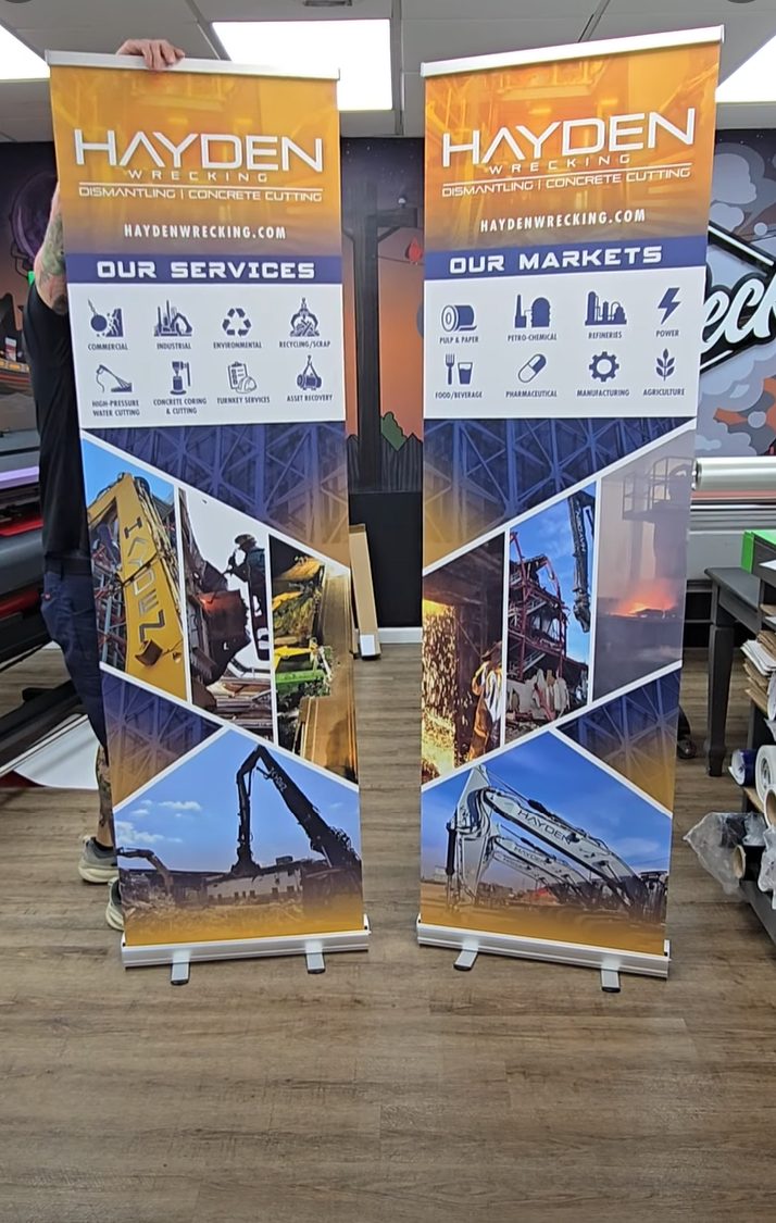 Two Hayden Wrecking retractable banner stands printed by Full Deck